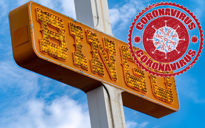 neon bingo hall sign with coronavirus stamp