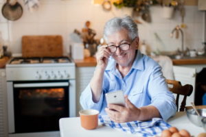 happy older lady with phone