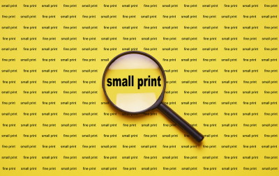 small print and magnifying glass
