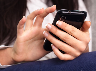 female holding mobile phone