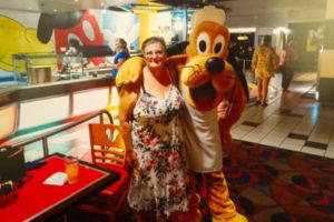 jean jones standing with pluto character