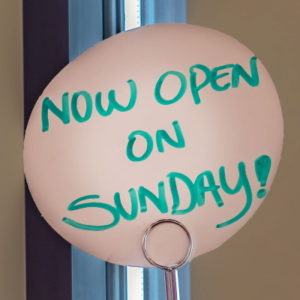 now open sunday written sign