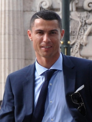 cristinano ronaldo in a suit